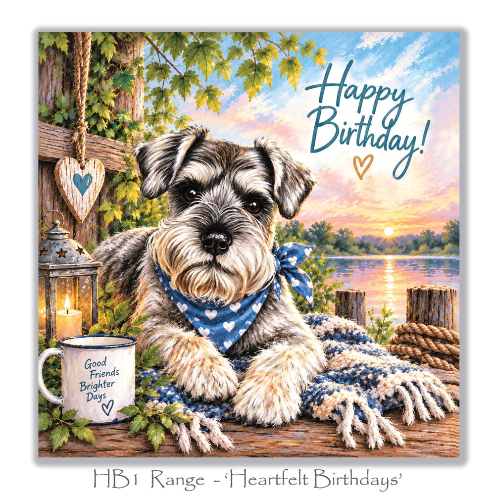 Beautiful dog birthday greeting card with a Miniature Schnauzer, glowing candle lantern, cosy blue blanket, rustic mug and colourful lakeside sunset.