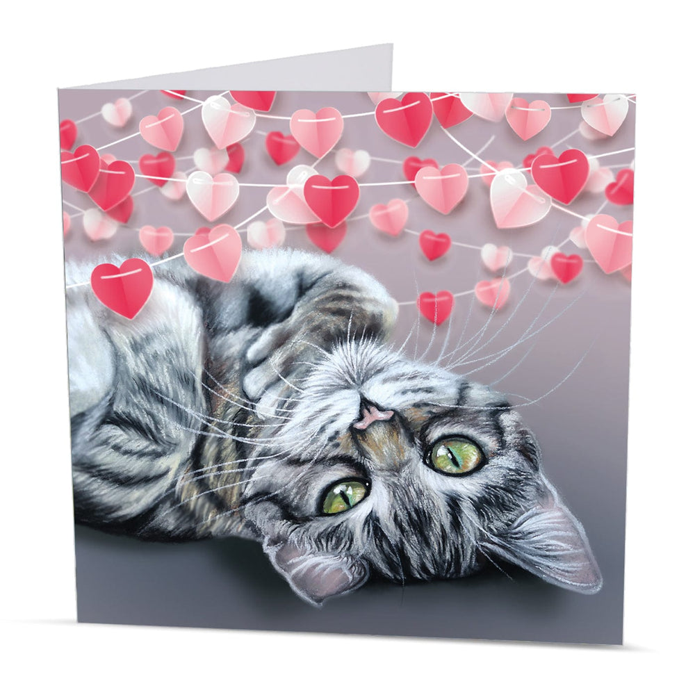 Adorable Valentine’s Day card with a relaxed tabby kitten under a string of hearts, created from original artwork by Irisha.
