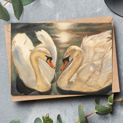fine art greeting card featuring two white swans
