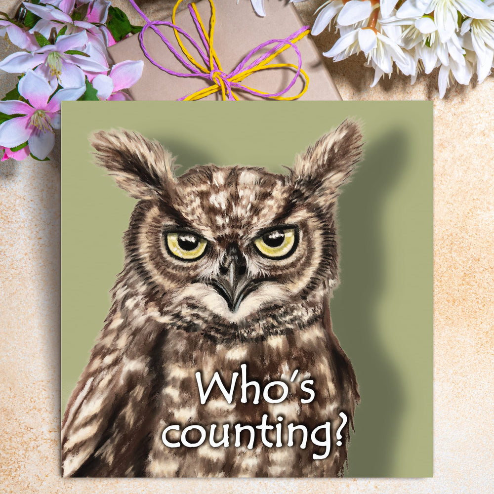 Funny owl birthday card featuring a grumpy illustrated owl with yellow eyes and the caption “Who’s counting?”