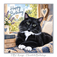 Beautiful cat birthday greeting card with a long-haired black and white cat, lavender flowers, daisies, vintage books and cosy blue knitted blankets.