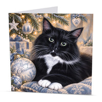Square cat Christmas greeting card featuring a fluffy black and white cat beside a Merry Christmas bauble
