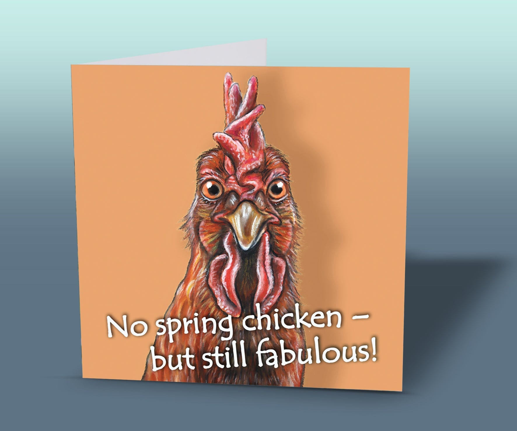 Light-hearted animal birthday card showing a comical chicken on an orange background, ideal for anyone with a sense of humour.