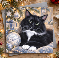 Black and white cat Christmas greeting card featuring a fluffy tuxedo cat surrounded by festive decorations