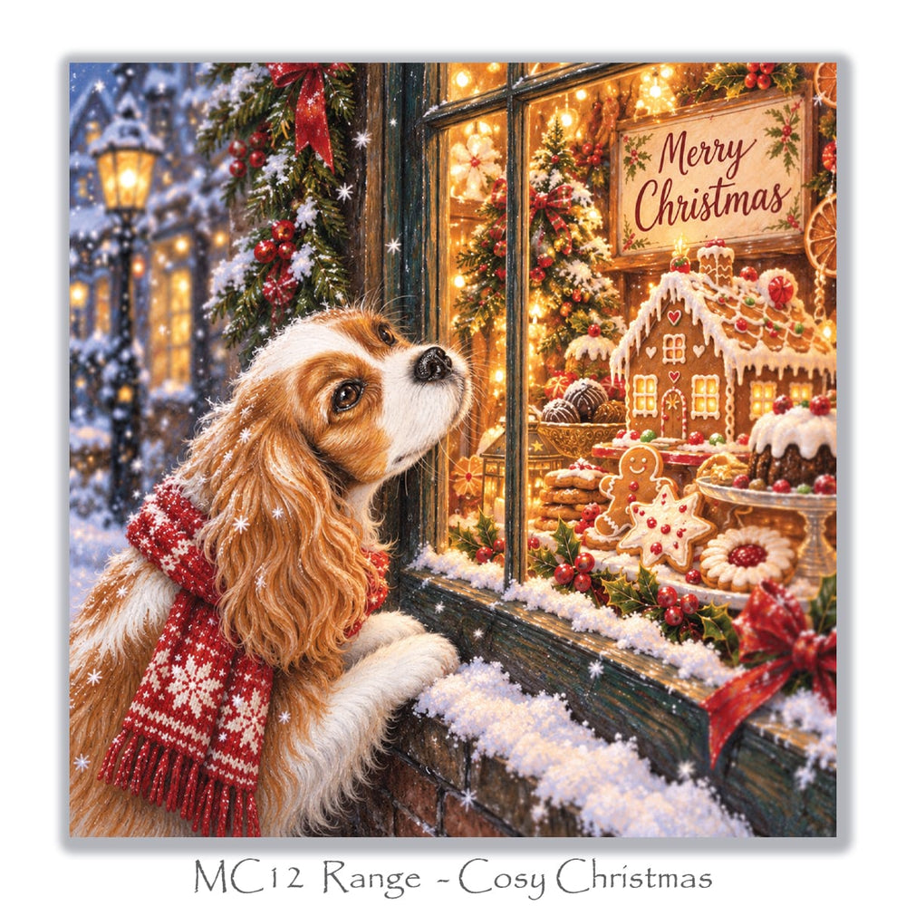 Christmas card for Cavalier King Charles Spaniel lovers showing a dog admiring gingerbread houses and Christmas treats