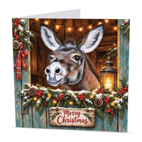 Square donkey Christmas card featuring original animal artwork with a Merry Christmas wooden sign on a festive stable door