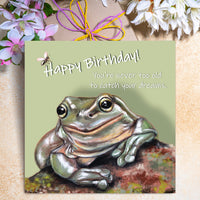 Funny frog birthday card featuring an illustrated frog with the caption “You’re never too old to catch your dreams.”