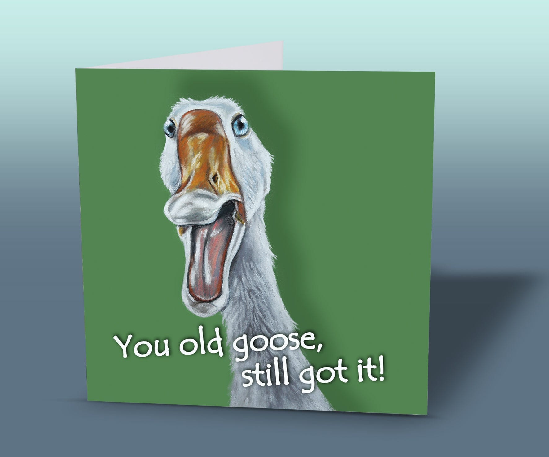 Light-hearted farm animal birthday card showing a funny white goose with blue eyes and humorous caption.