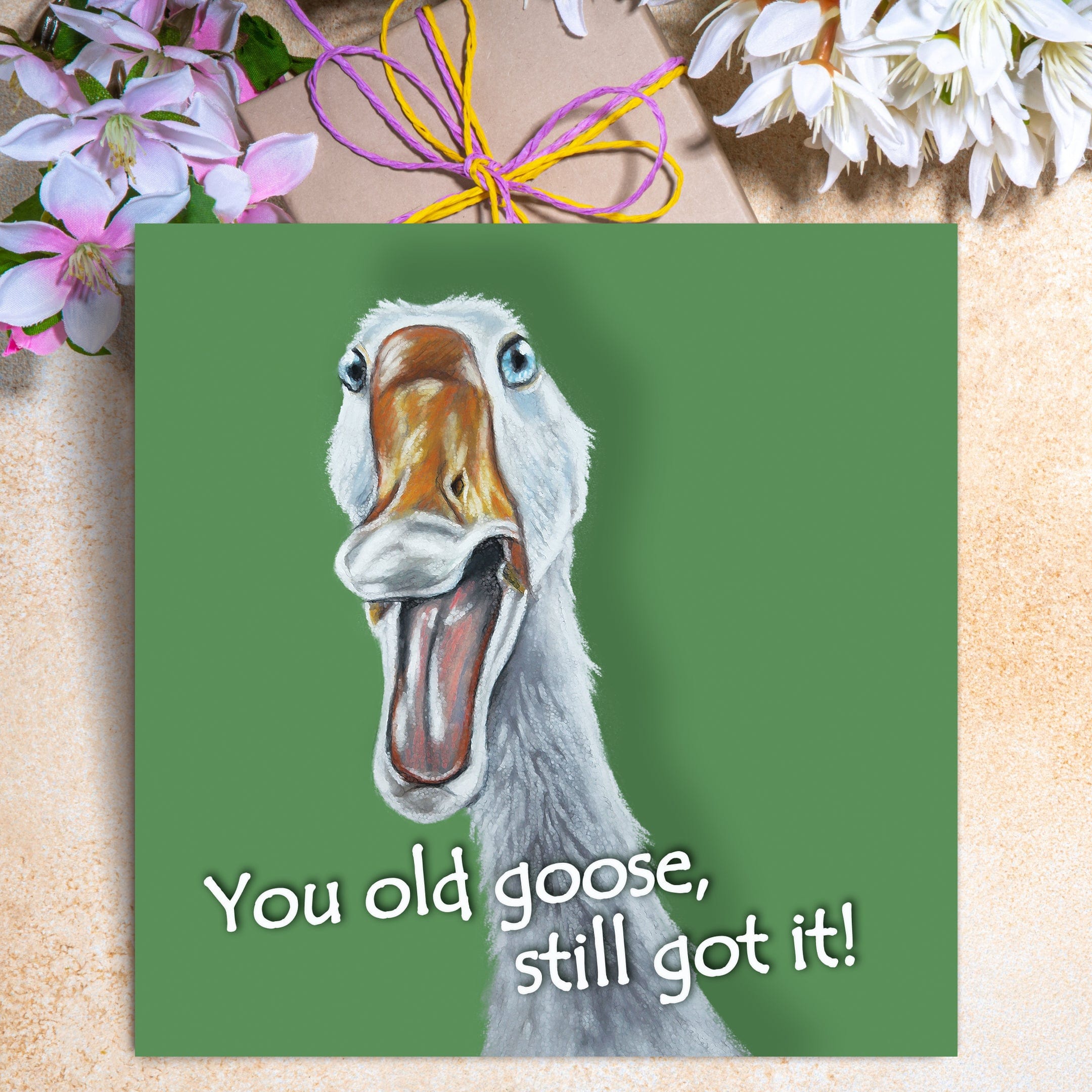 Funny goose birthday card featuring a comical white goose with open beak and the caption You old goose, still got it!